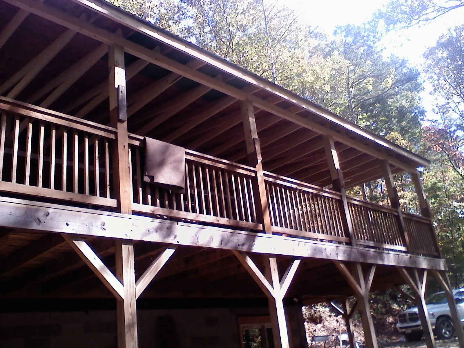 Timber framing under a new elevated porch and deck — Roof Leak Repair in North Billerica by Roofing Brothers